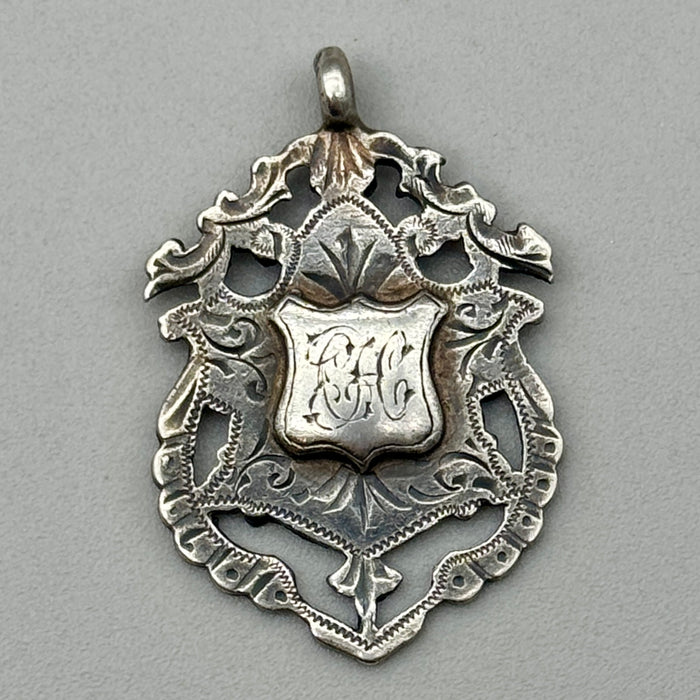 Medaglia da orologio argento sterling Watch Fob C.H. iniziali 1920 ca