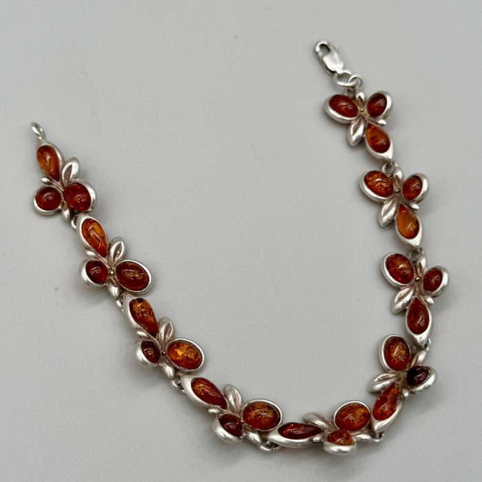 Bracciale in ambra ed argento 925 decorazioni floreali Italia 1990 ca
