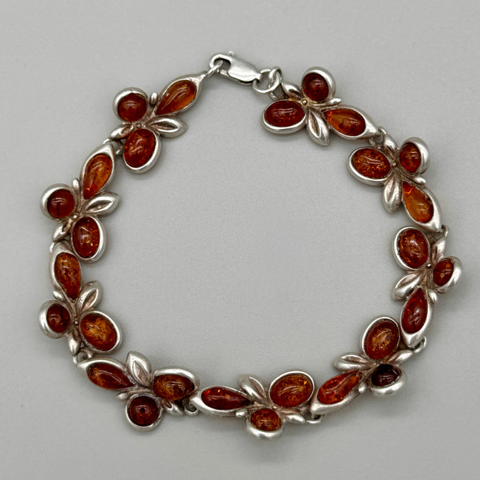Bracciale in ambra ed argento 925 decorazioni floreali Italia 1990 ca