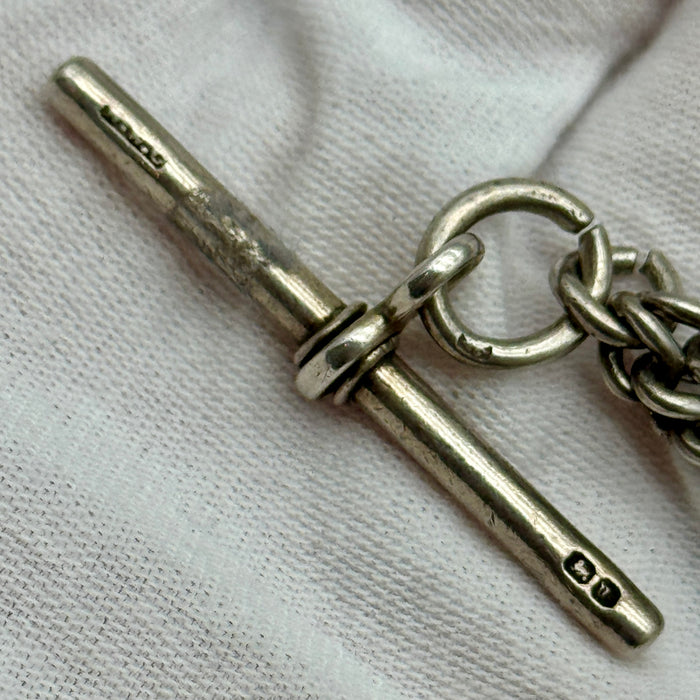 Catena orologio tasca argento con medaglia Vittoriana Regno Unito fine XIX sec.