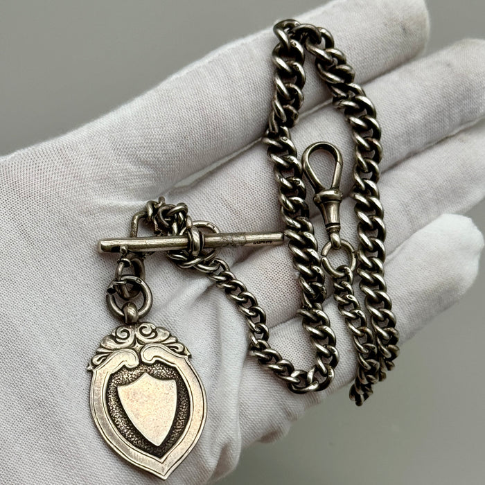 Catena orologio tasca argento con medaglia Vittoriana Regno Unito fine XIX sec.