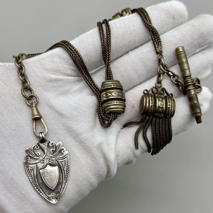 Catena orologio tasca argento nappa con medaglia Vittoriana Regno Unito fine XIX sec.