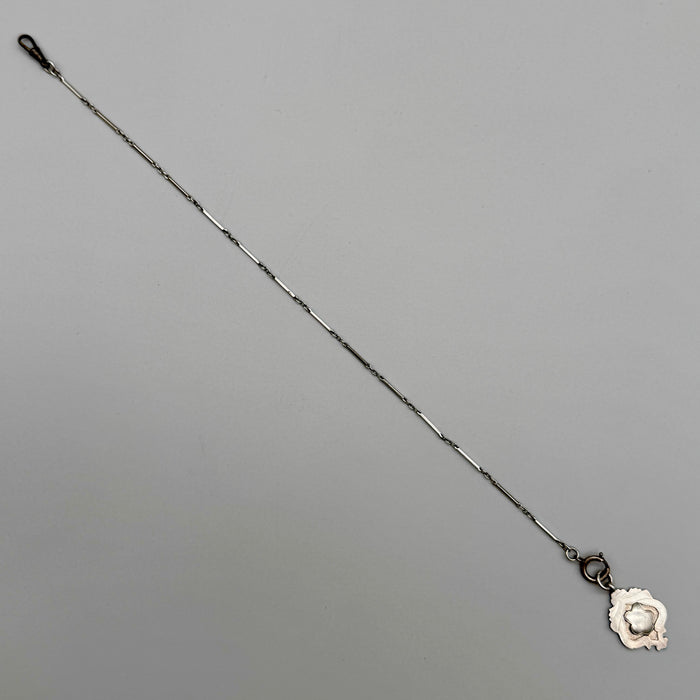 Catena orologio tasca argento con medaglia Vittoriana Regno Unito fine XIX sec.