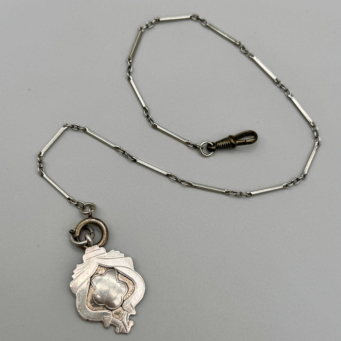 Catena orologio tasca argento con medaglia Vittoriana Regno Unito fine XIX sec.