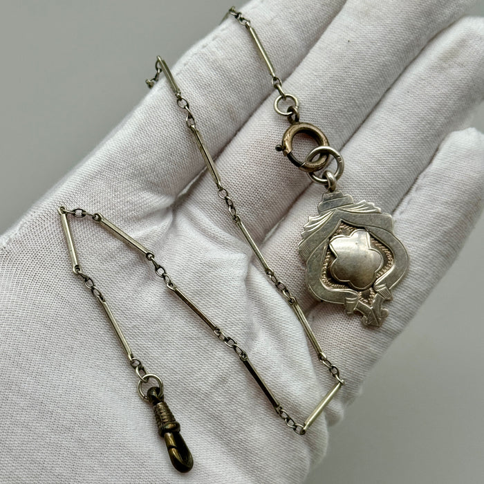 Catena orologio tasca argento con medaglia Vittoriana Regno Unito fine XIX sec.