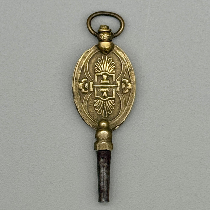 Chiave da orologio antica decorata leone arco frecce Francia metà XIX sec.