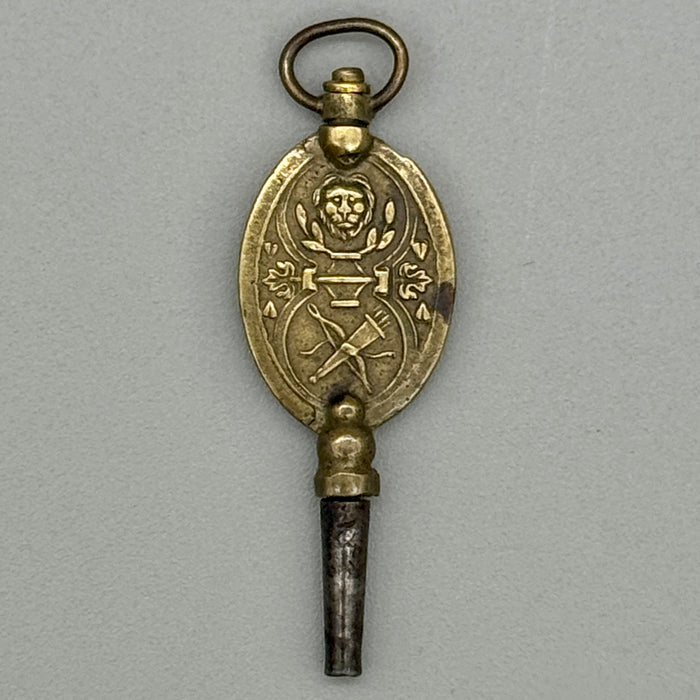 Chiave da orologio antica decorata leone arco frecce Francia metà XIX sec.